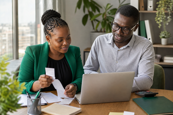 Kenyan finance team reviewing a reconciled monthly ledger