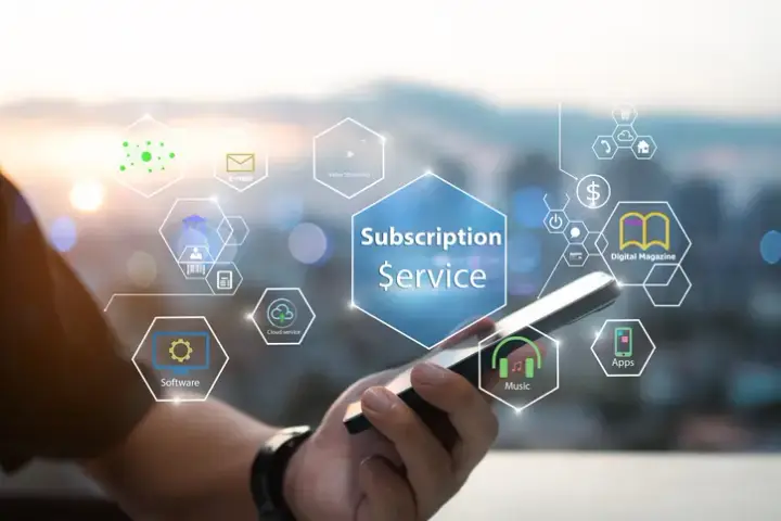 Subscription business owner reviewing recurring revenue and bookkeeping dashboard with FedhaTrac